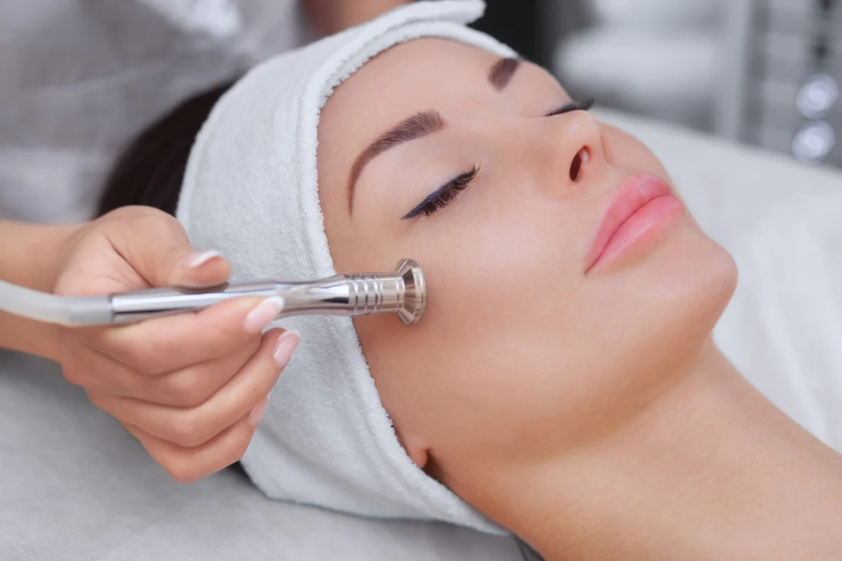 A woman getting a microdermabrasion treatment