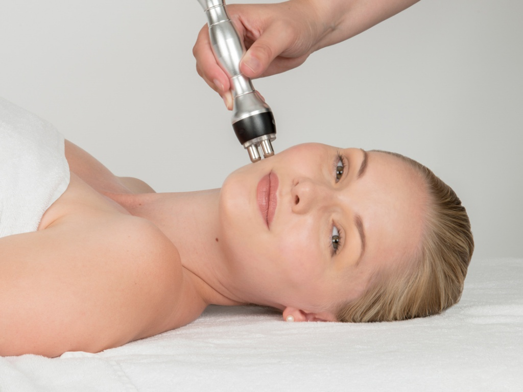 A woman having a microneedling treatment