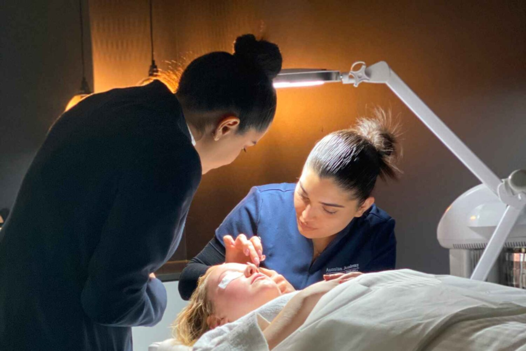 Two therapists performing a rf skin tightening treatment on a patient
