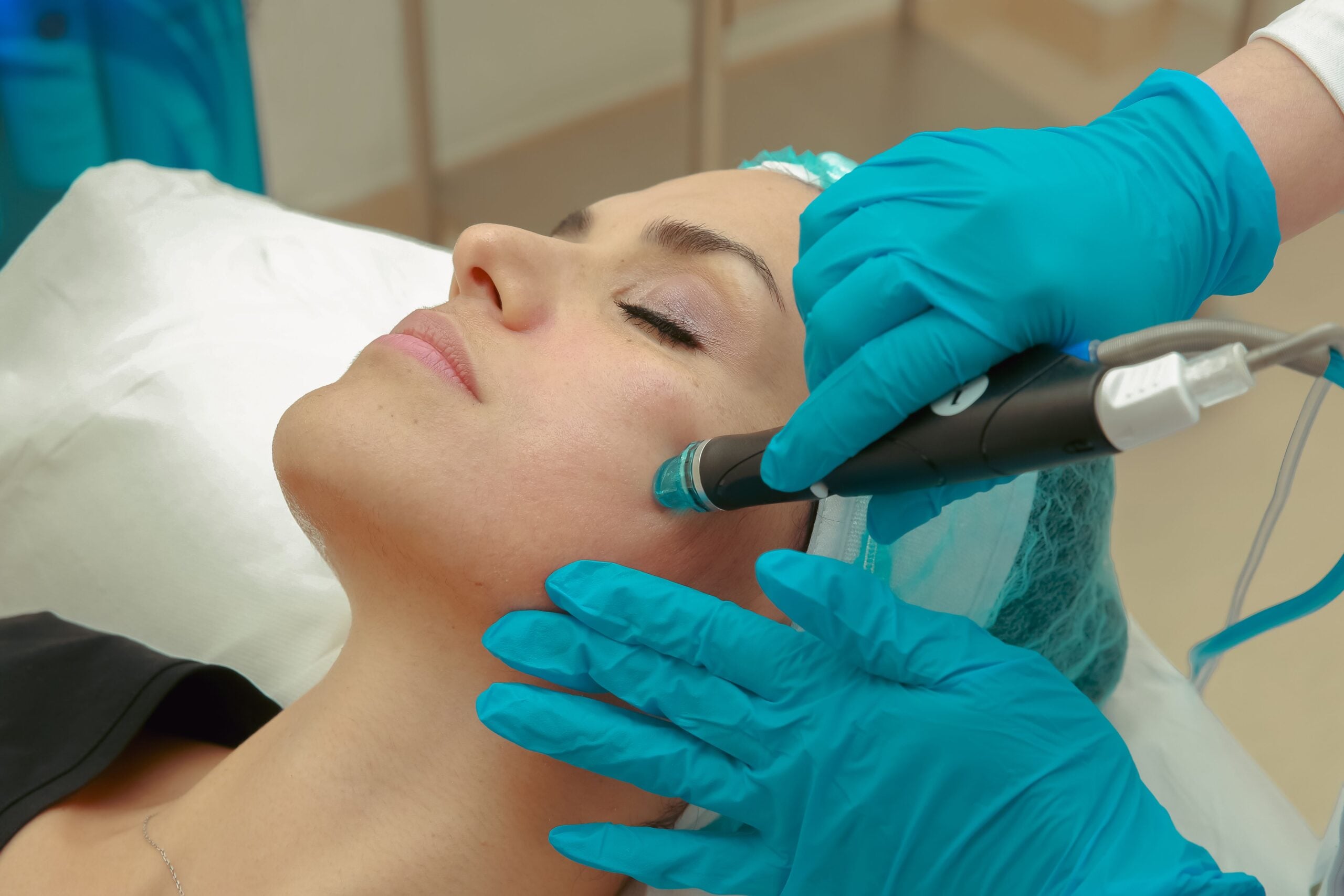 A woman getting a professional hydradermabrasion treatment