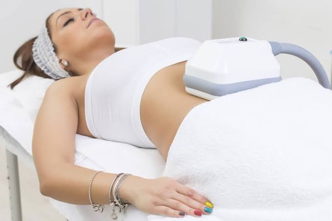 A woman receiving a fat freezing treament